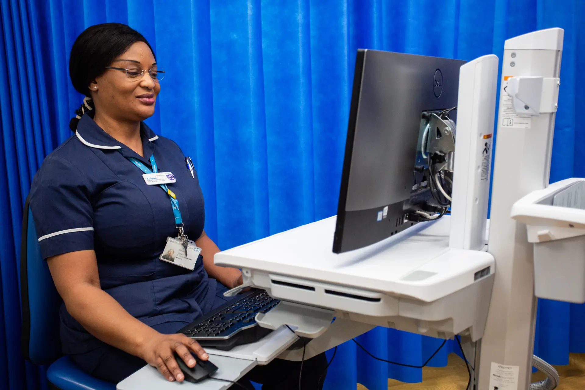 midwife at computer