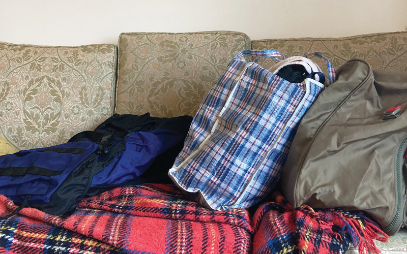 bags clothing on a couch.Supplied_img_7355.png