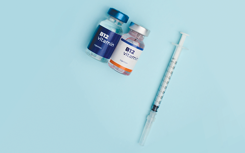 Syringe and vitamins_CREDIT_Shutterstock-2735347349